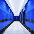 Modern Elevator Hallway With Blue Glass Walls Light Marble Flooring And Ceiling Lights