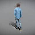 A Woman Standing in Blue Polka Dot Shirt White Undershirt Jeans Boots on Gray Background