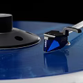 Headphone Speaker Turntable with Blue Vinyl Record Stylus Arm and Audio Player Equipment