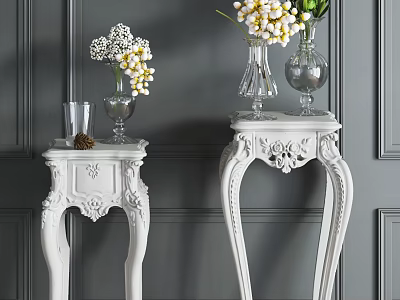White Carved Side Tables With Glass Vases And Flowers On Gray Wall Backdrop 3d model