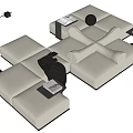 Modern beige modular sectional sofa with black trim side tables floor lamp and books