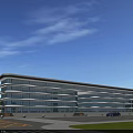 Modern Commercial Complex With Glass Facade Multi Storey Building Surrounding Roads And Green Spaces