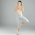 Woman Practicing Yoga In Single Leg Standing Pose With Gray Sportswear