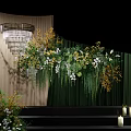 Floral Installation With Green Backdrop White Flowers Wooden Panels And Stage Candle Decor