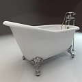 Elegant White Freestanding Bathtub With Ornate Metal Feet And Silver Faucet