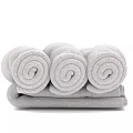 Three Soft Gray Rolled Towels Ideal For Bathroom And Daily Use