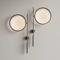 Modern Wall Lamps With Round Shades Black Metal Frames Mounted On Gray Wall