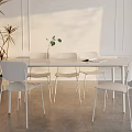 Modern Glass Tabletop Dining Set With Four White Chairs Sunlit White Walls And Plant