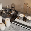 Stylish Glass And Metal Candle Holders With Lit Candles On Tray And Books