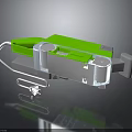 Green And Silver Electronic Appliance With Plug Cable And Modern Components