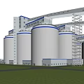 Industrial Plant Exterior View With Large Silos Blue Accents Green Lawn And Metal Structures