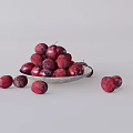 Purple Red Plums Piled In Silver Plate With Scattered Ones On Light Gray Background
