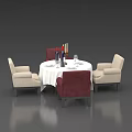 Round Dining Table Set With White Tablecloth Tableware Wine Glasses Candles And Red Beige Chairs