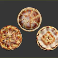 Three Decorative Homemade Pies With Golden Crust And Red Fruit Toppings