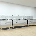 Professional Commercial Kitchen Featuring Stainless Steel Stoves And Cooking Ranges