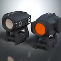 Black Tactical Optic Sights With White And Orange Lens Covers On Mounts