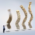 Spiral Wooden Art Installation Made Of Book Pages With Curved Upward Design And Person Nearby