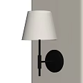 Modern Wall Lamp With White Fabric Shade And Black Metal Bracket On Beige Wall