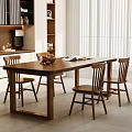 Wooden Dining Table Set With Four Matching Chairs And Open Book On Top