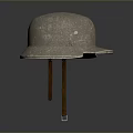 Antique Military Helmet With Worn Metallic Surface And Historical Protective Design