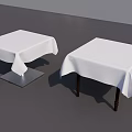 Stylish Dining Table Set With White Tablecloths Silver Metal Bases And Dark Wooden Legs