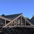 Museum Building With Wooden Structure Triangular Brown Roof Surrounded By Greenery Under Blue Sky