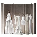 Elegant Bridal Clothing Store Featuring White Wedding Dresses Mannequin And Hanging Gowns