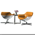 Modern Orange White Chair Table Set With Metal Legs Side Table And Pink Flower Vase