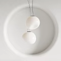 Two White Spherical Pendant Lights Hanging On White Wall For Modern Interior Design
