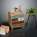 Wooden Dresser with Colorful Drawers Plant Stand Green Plant Vase Book and Wooden Box Towel