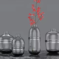 Brown Glass Vases In Different Sizes Placed On Marble Tabletop For Home Decor