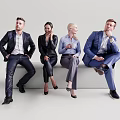 Four Business Professionals in Formal Attire Sitting on Bench Together