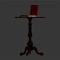 Classic Dark Brown Wooden Round Accent Table With Three Legs And Red Box On Top