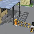Entrance Gate With Security Booth Barrier Gate And Yellow Industrial Building Under Blue Sky