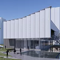 Modern Sales Office Building with Glass Facade Green Landscape Water Feature and Pedestrian Walkway