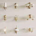 Different Styles of Wall Sconces with Gold and White Finishes and Glass Shades