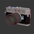 Vintage Electronic Camera With Silver Body Black Leather Surface And Large Classic Lens