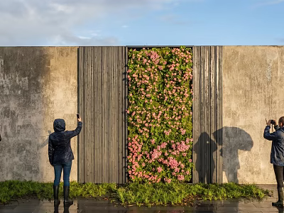 Stunning Living Plant Wall With Pink Flowers Against Gray Concrete Wall As People Take 3d model