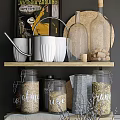 Stylish Kitchen Utensils Storage With Glass Jars Baskets And Mugs On Shelves