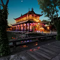 Ancient Chinese Architectural Building By Water At Night With Lights And Reflections