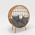 Single Seater Rattan Sofa with Spherical Frame Gray Cushions and Wooden Legs