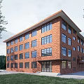 Modern Red Brick School Building With Multi Story Windows And Grassy Surroundings 3d model