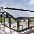 Outdoor Modern Glass Roof Sunroom With Black Frame And Grass Surroundings