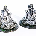 Pair of Classical Cherub Sculptures With Ornate Circular Base And Decorative Details