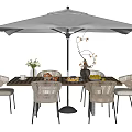 Outdoor Dining Table With Wicker Chairs Large Umbrella Fruit And Flower Vase