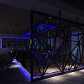 Modern Cyber Cafe Interior With Blue Lighting Black Metal Partition Computers Tables And Green Plants