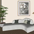 Curved Sectional Sofa With Green Cushions In Living Room With Shell Artwork And Floor Lamp