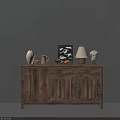 Rustic Wooden Sideboard Featuring White Vase Picture Frame Table Lamp And Sculpture Against Gray Wall