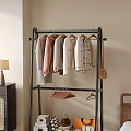 Black Metal Clothes Rack With Hanging Neutral Colored Clothes Leather Bag And Wooden Hangers