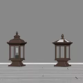 Two Classic Outdoor Lanterns With Decorative Tops And Lit Glass Panels